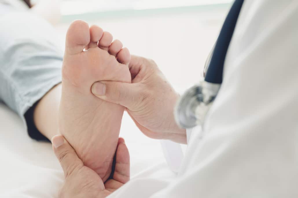 Doctor giving a heel diagnosis of the foot